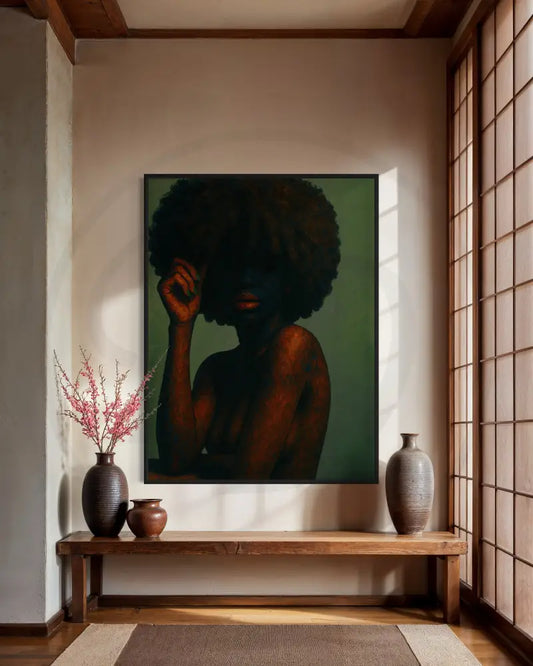 Portrait of Black woman with voluminous afro and shadowed face