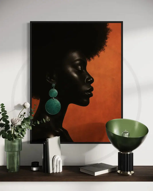 Afrocentric profile portrait digital wall art of a Black woman with green earrings on orange background. Printable African art for modern décor.