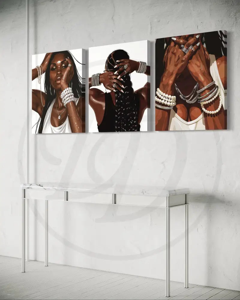 Black culture-inspired wall art triptych with pearls, rings, and bracelets.

