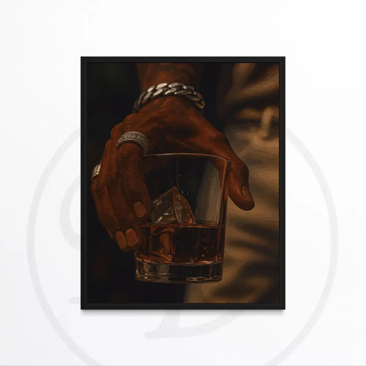 Black hand with jewelry holding whiskey glass